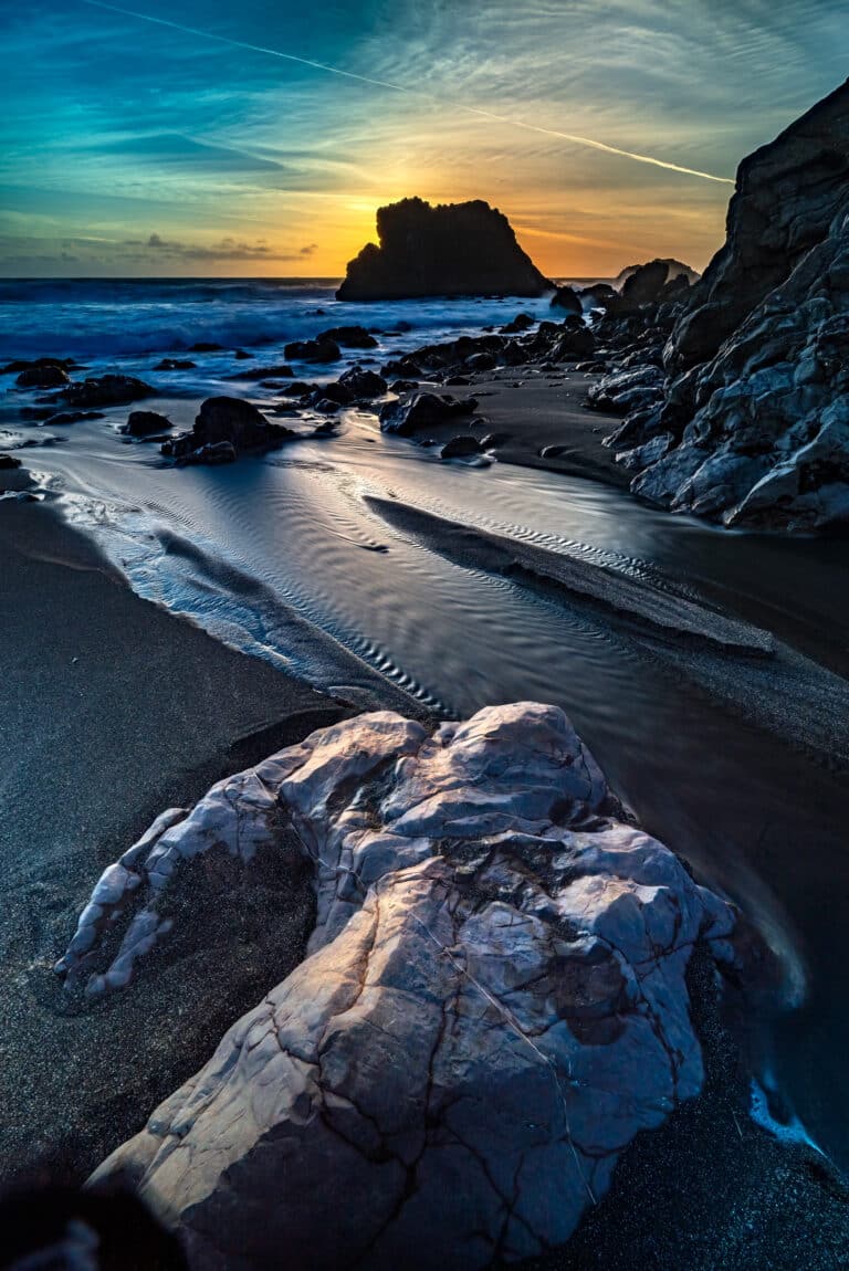 A rock, the short, sunset